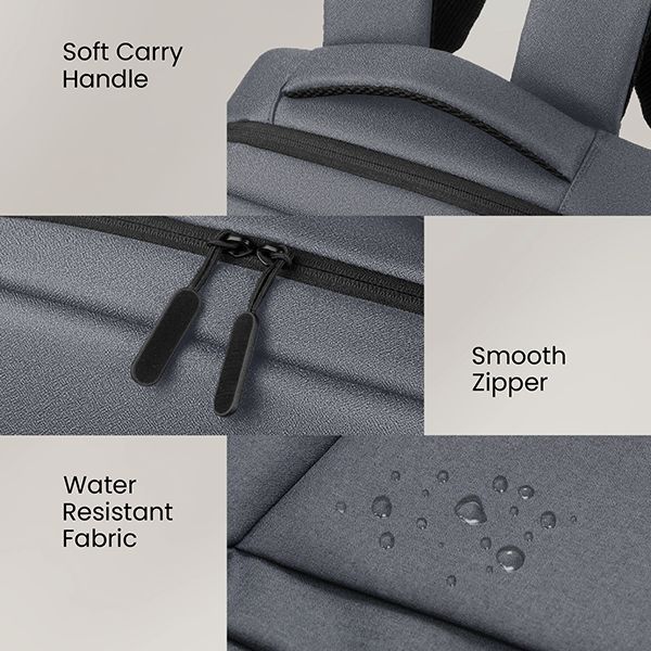 Close-up of the grey laptop backpack's soft carry handle, smooth zipper and water resistant fabric beaded with water droplets