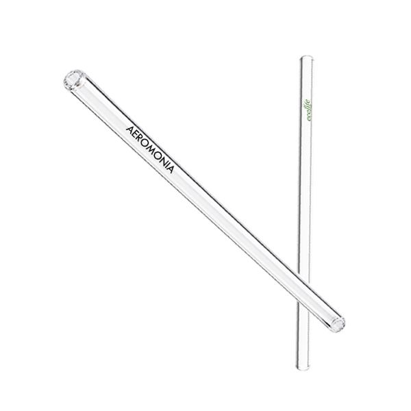 Two clear borosilicate glass straws lying at an angle, one of them printed with a logo.