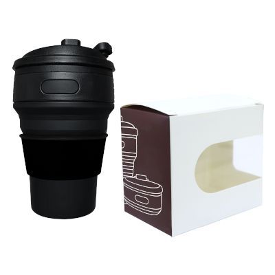 Black collapsible cup with flip lid standing next to its white window gift box