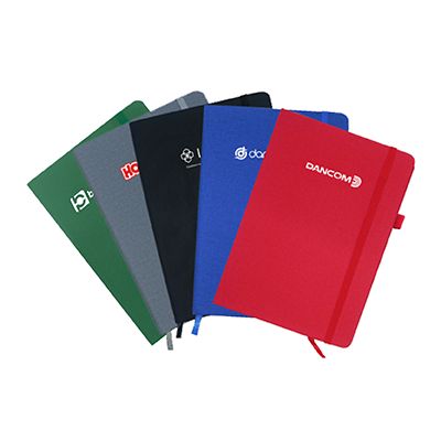 PU fabric hard cover A5 notebooks fanned out in green, grey, blue and red, each with an elastic closure and a printed logo