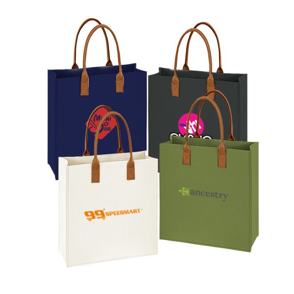 Four felt tote bags in navy, dark grey, cream and olive green with tan leather handles, each printed with a logo.